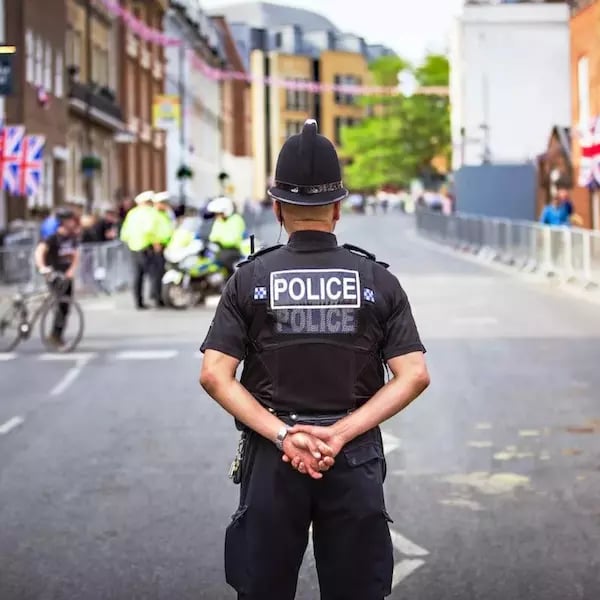 Back of a policeman in the street